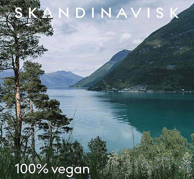 Skandinavisk KOTO 'Home' Scented Candle. Fragrance Notes: Vanilla Beans and Dried Orange Peel, Amber and Leather. 7.0 oz.