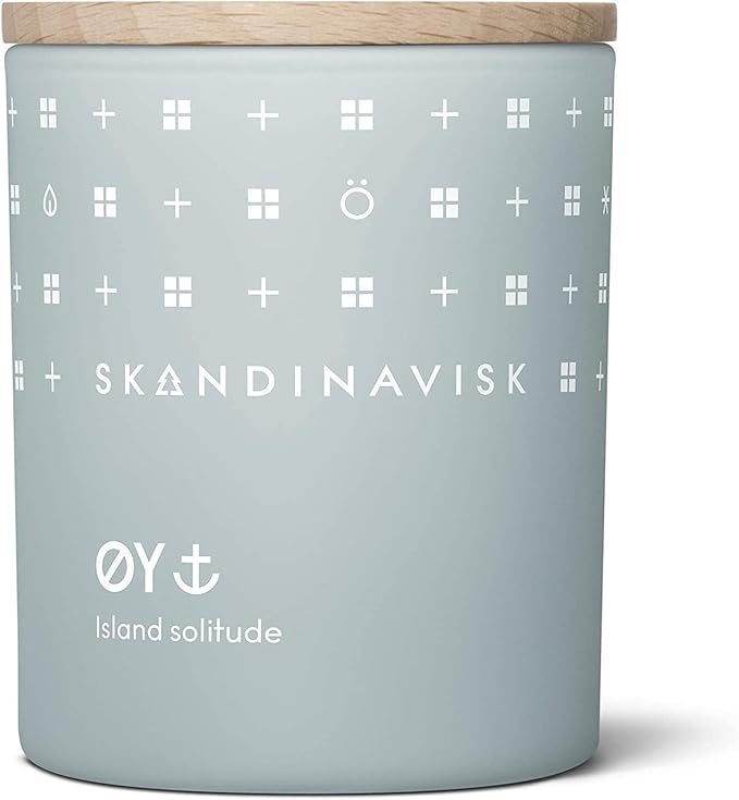 Skandinavisk ØY 'Island' Mini Scented Candle. Fragrance Notes: Crabapple and Dog Rose, Water Mosses and Green Leaves. 2.3 oz.