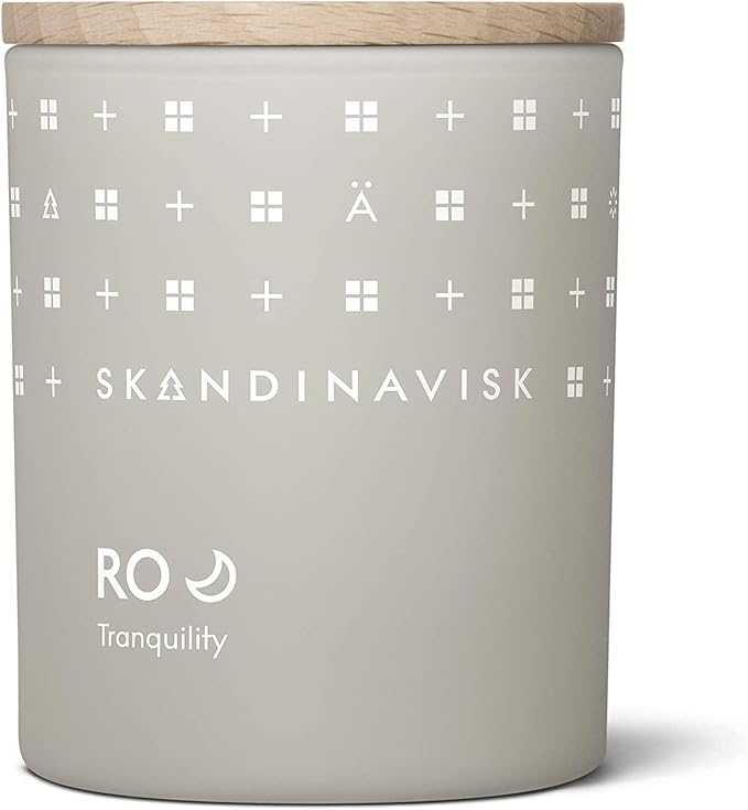Skandinavisk RO 'Tranquility' Mini Scented Candle. Fragrance Notes: Cut Grass and Fallen Leaves, Cucumber and Wild Violets. 2.3 oz.