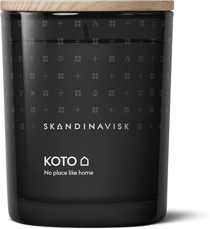 Skandinavisk KOTO 'Home' Scented Candle. Fragrance Notes: Vanilla Beans and Dried Orange Peel, Amber and Leather. 7.0 oz.
