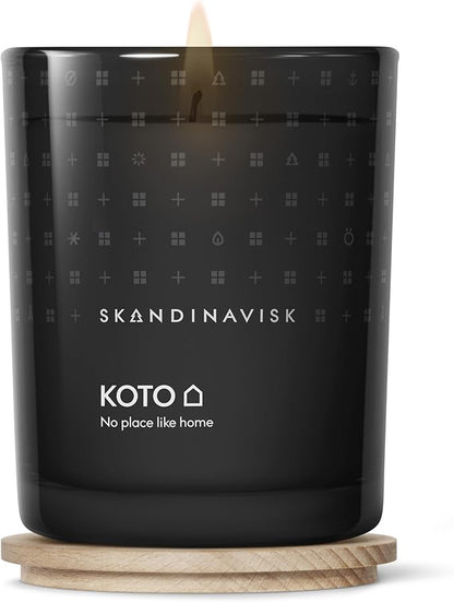 Skandinavisk KOTO 'Home' Scented Candle. Fragrance Notes: Vanilla Beans and Dried Orange Peel, Amber and Leather. 7.0 oz.