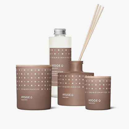 Skandinavisk Hygge 'Cosiness' Scented Candle. Fragrance Notes: Black Tea and Mint Leaves, Dried Apples and Baked Cinnamon. 7.0 oz.