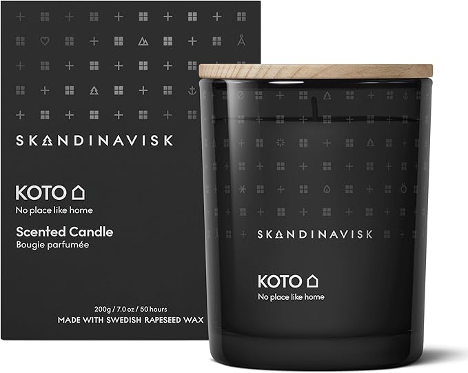 Skandinavisk KOTO 'Home' Scented Candle. Fragrance Notes: Vanilla Beans and Dried Orange Peel, Amber and Leather. 7.0 oz.