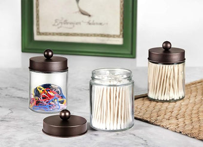 Amolliar 4 Pc Glass Apothecary Jars - Countertop Qtip Dispenser Holder with Stainless Steel Lids&Cute Stickers -Bathroom Vanity Storage Organizer Set for Qtips,Cotton Swabs/Rounds (Bronze)