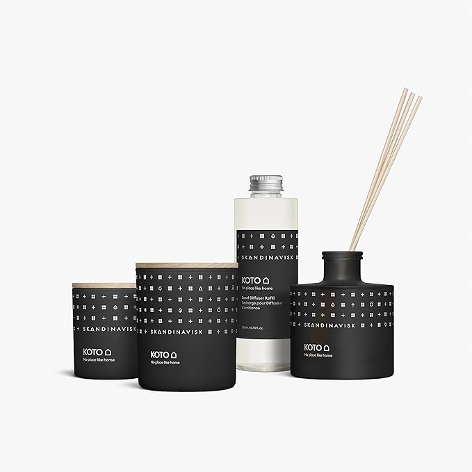 Skandinavisk KOTO 'Home' Mini Scented Candle. Fragrance Notes: Vanilla Beans and Dried Orange Peel, Amber and Leather. 2.3 oz.