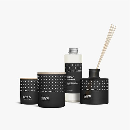 Skandinavisk KOTO 'Home' Mini Scented Candle. Fragrance Notes: Vanilla Beans and Dried Orange Peel, Amber and Leather. 2.3 oz.