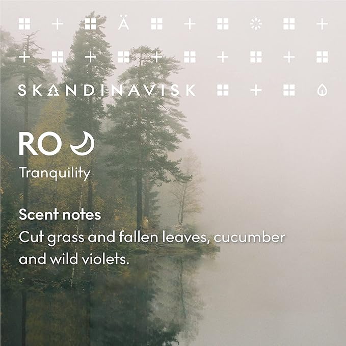 Skandinavisk RO 'Tranquility' Scented Candle. Fragrance Notes: Cut Grasses and Fallen Leaves, Cucumber and Wild Violets. 7.0 oz.