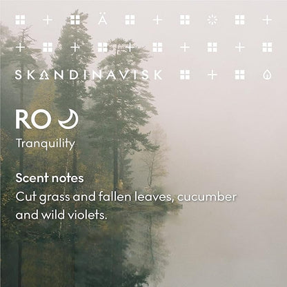 Skandinavisk RO 'Tranquility' Scented Candle. Fragrance Notes: Cut Grasses and Fallen Leaves, Cucumber and Wild Violets. 7.0 oz.
