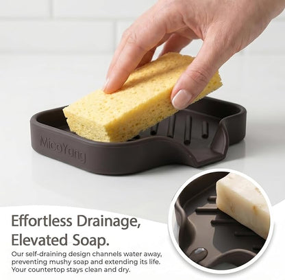 MicoYang Silicone Soap Dish with Drain Spout, Self-Draining Sink Organizer Tray for Bathroom and Kitchen, Sponges, Dispensers and Soap Holder, Non-Slip and Dishwasher Safe, Coffee (Compact, 4.9"×3.2")