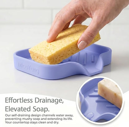 MicoYang Silicone Soap Dish with Drain Spout, Self-Draining Sink Organizer Tray for Bathroom & Kitchen, Sponges, Dispensers & Soap Holder, Non-Slip & Dishwasher Safe, Light Purple (Compact, 4.9"×3.2")