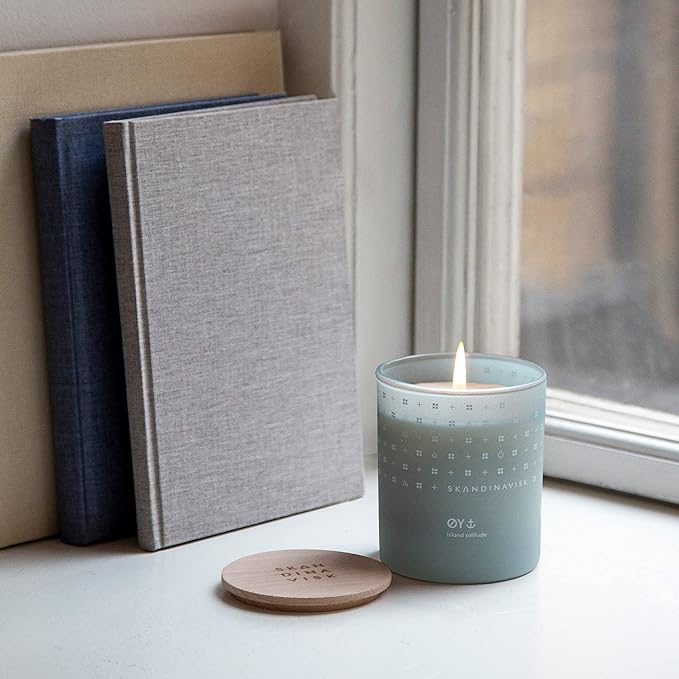 Skandinavisk ØY 'Island' Mini Scented Candle. Fragrance Notes: Crabapple and Dog Rose, Water Mosses and Green Leaves. 2.3 oz.