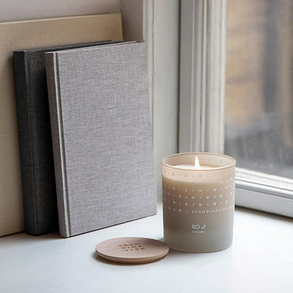 Skandinavisk RO 'Tranquility' Mini Scented Candle. Fragrance Notes: Cut Grass and Fallen Leaves, Cucumber and Wild Violets. 2.3 oz.