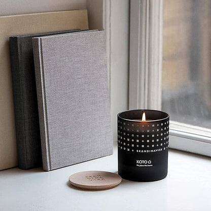 Skandinavisk KOTO 'Home' Mini Scented Candle. Fragrance Notes: Vanilla Beans and Dried Orange Peel, Amber and Leather. 2.3 oz.