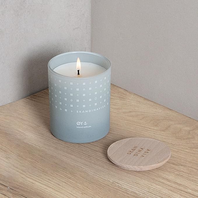 Skandinavisk ØY 'Island' Mini Scented Candle. Fragrance Notes: Crabapple and Dog Rose, Water Mosses and Green Leaves. 2.3 oz.
