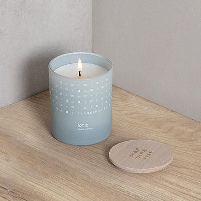 Skandinavisk ØY 'Island' Mini Scented Candle. Fragrance Notes: Crabapple and Dog Rose, Water Mosses and Green Leaves. 2.3 oz.