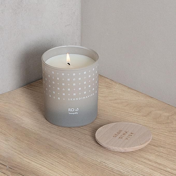 Skandinavisk RO 'Tranquility' Mini Scented Candle. Fragrance Notes: Cut Grass and Fallen Leaves, Cucumber and Wild Violets. 2.3 oz.