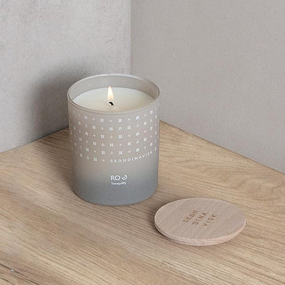 Skandinavisk RO 'Tranquility' Scented Candle. Fragrance Notes: Cut Grasses and Fallen Leaves, Cucumber and Wild Violets. 7.0 oz.