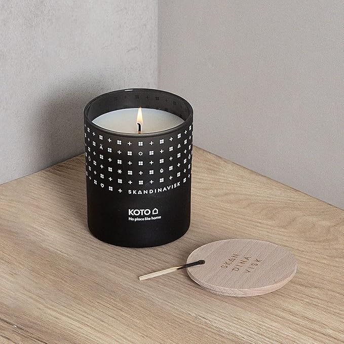 Skandinavisk KOTO 'Home' Mini Scented Candle. Fragrance Notes: Vanilla Beans and Dried Orange Peel, Amber and Leather. 2.3 oz.