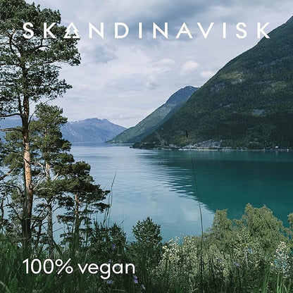 Skandinavisk RO 'Tranquility' Scented Candle. Fragrance Notes: Cut Grasses and Fallen Leaves, Cucumber and Wild Violets. 7.0 oz.